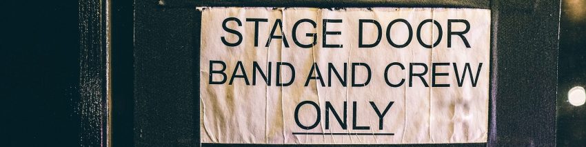 About the Dorky Geeky Nerdy Trivia Podcast Header depicting a stage door sign that reads "Stage Door, Band and Crew Only"