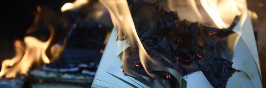 Banned Books Trivia Header showing books burning.